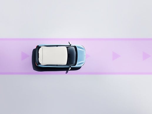 Top-down view of a light-blue toy car driving on a purple road with directional arrow markers.